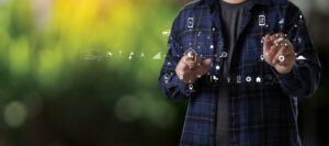 Agriculturist  Young farmers man using tablet computer analysis data check data network in the Internet vegetable background agricultural farm technology concept